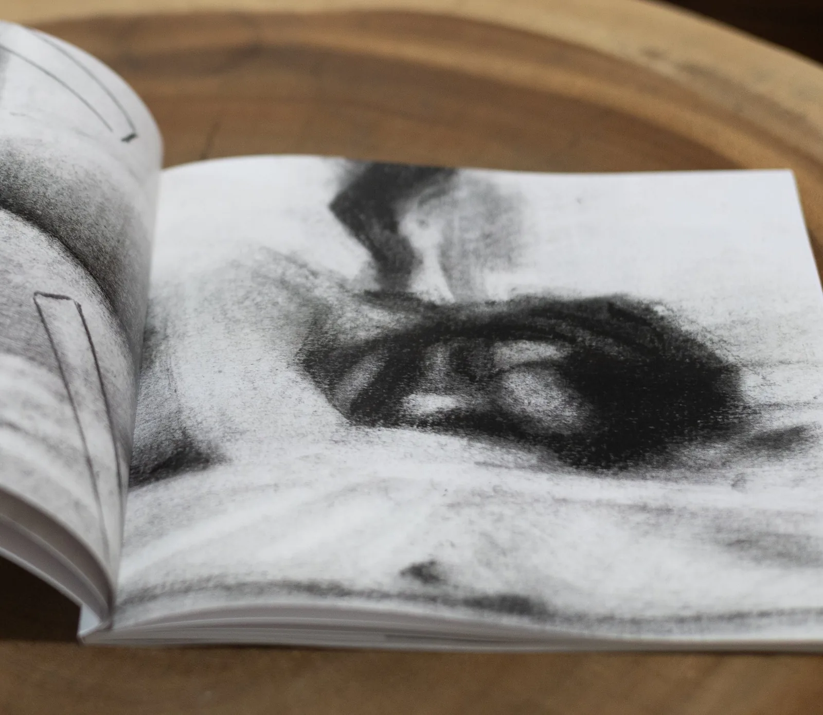 Inner Body – Charcoal Close-up Close-up of a soft charcoal drawing printed full-bleed in Inner Body, a somatic sketchbook